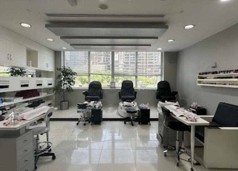 Bright nail spa at Crystal Beauty Lounge, Dubai, AE with modern manicure stations and comfortable seating.