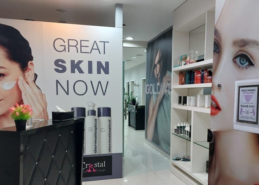 Interior of Crystal Beauty Lounge in Dubai, AE, showcasing skincare displays and product shelves.