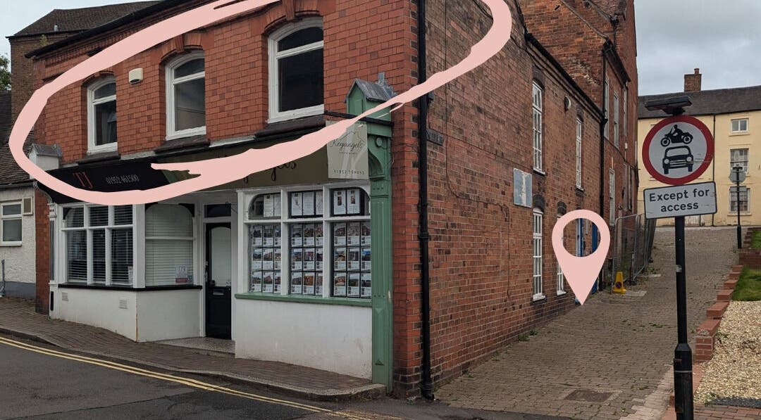 Front view of Skinfit Studio at Shifnal, England, GB, showcasing elegant brick exterior and signage.