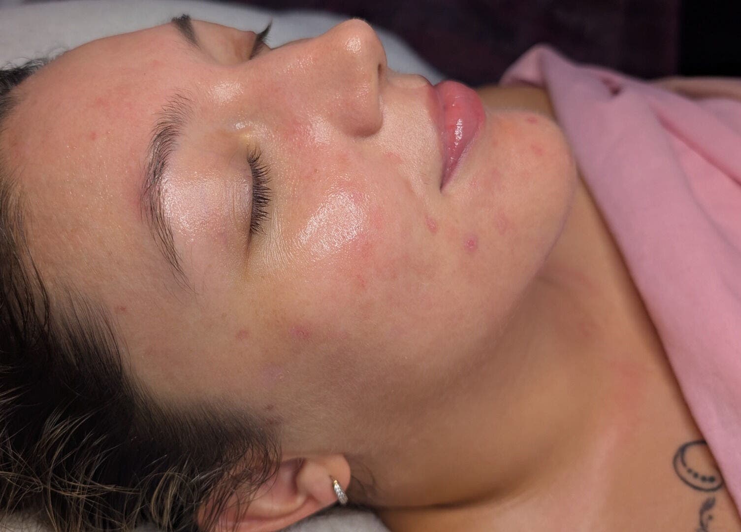 Relaxed woman with glowing skin after facial at Skinfit Studio, Shifnal, England, GB.