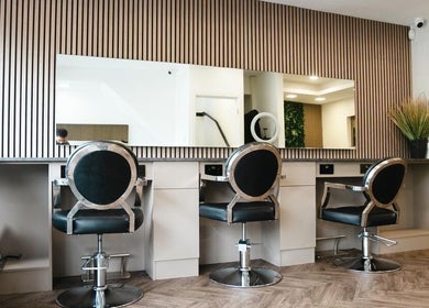 Modern salon styling chairs at VP Hair Art Co Sutton, Birmingham, England, GB with sleek, minimalist design.