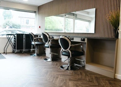 Modern salon interior with stylish chairs at VP Hair Art Co Sutton in Birmingham, England, GB.