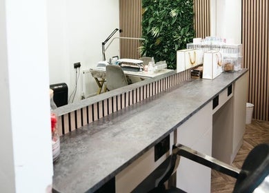 Modern salon design at VP Hair Art Co Sutton, located in Birmingham, England, GB, featuring sleek workstations.