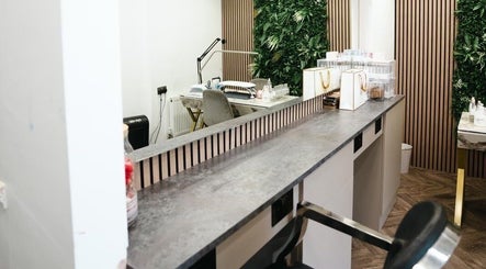Modern salon design at VP Hair Art Co Sutton, located in Birmingham, England, GB, featuring sleek workstations.