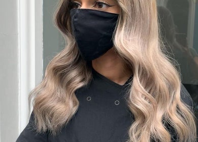 Model with wavy blonde hair at VP Hair Art Co Sutton, Birmingham, England, GB.