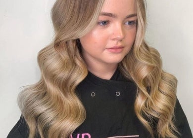 Blonde hair styled in soft waves at VP Hair Art Co Sutton, Birmingham, England, GB.