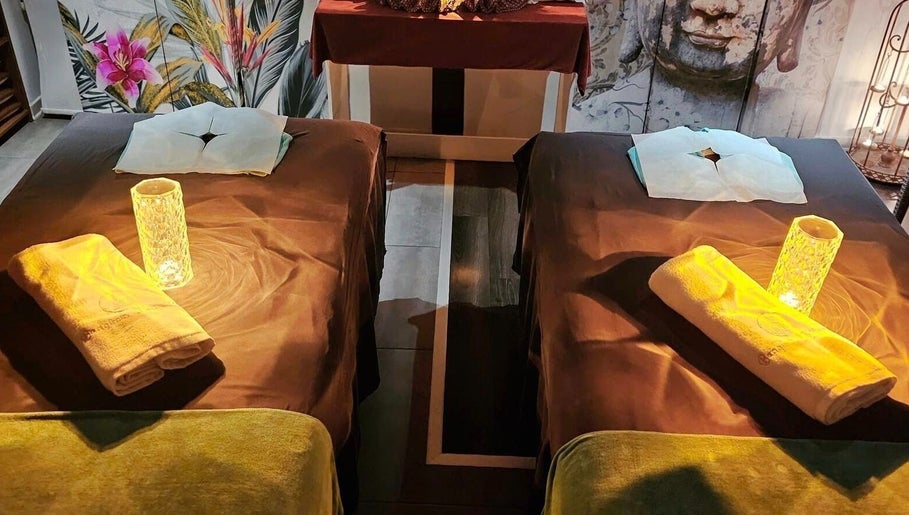 Relaxing spa room at Bangkok Wellness, St. Julian's, MT with two massage tables and calming ambiance.