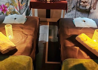 Relaxing spa room at Bangkok Wellness, St. Julian's, MT with two massage tables and calming ambiance.