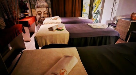 Relaxing massage room at Bangkok Wellness, St. Julian's, MT, featuring peaceful decor and soft lighting.