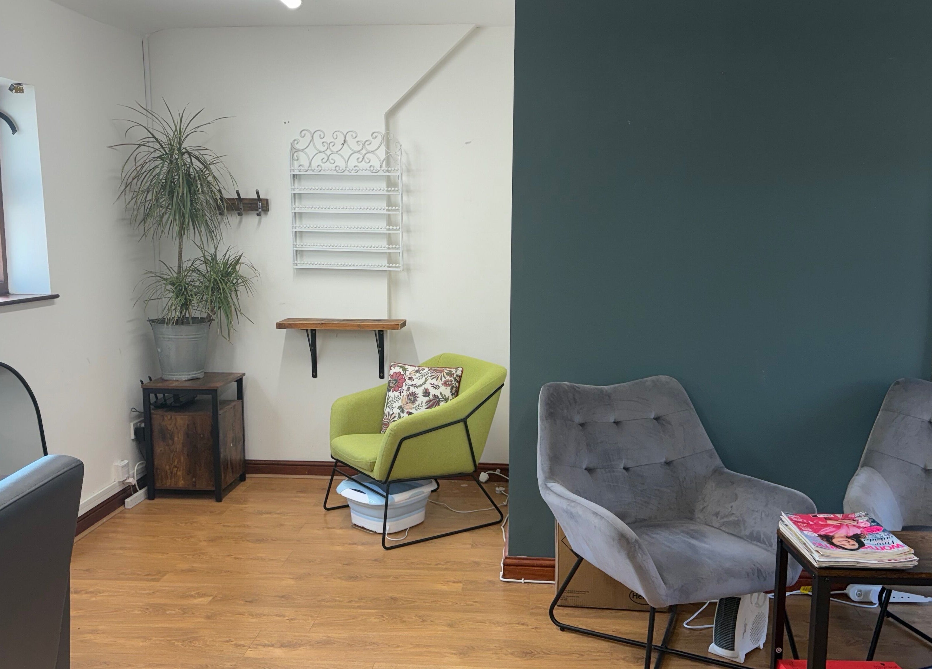 Cozy waiting area at Dovecote Hair Studio (Ice) with modern chairs, Oxford, England, GB.