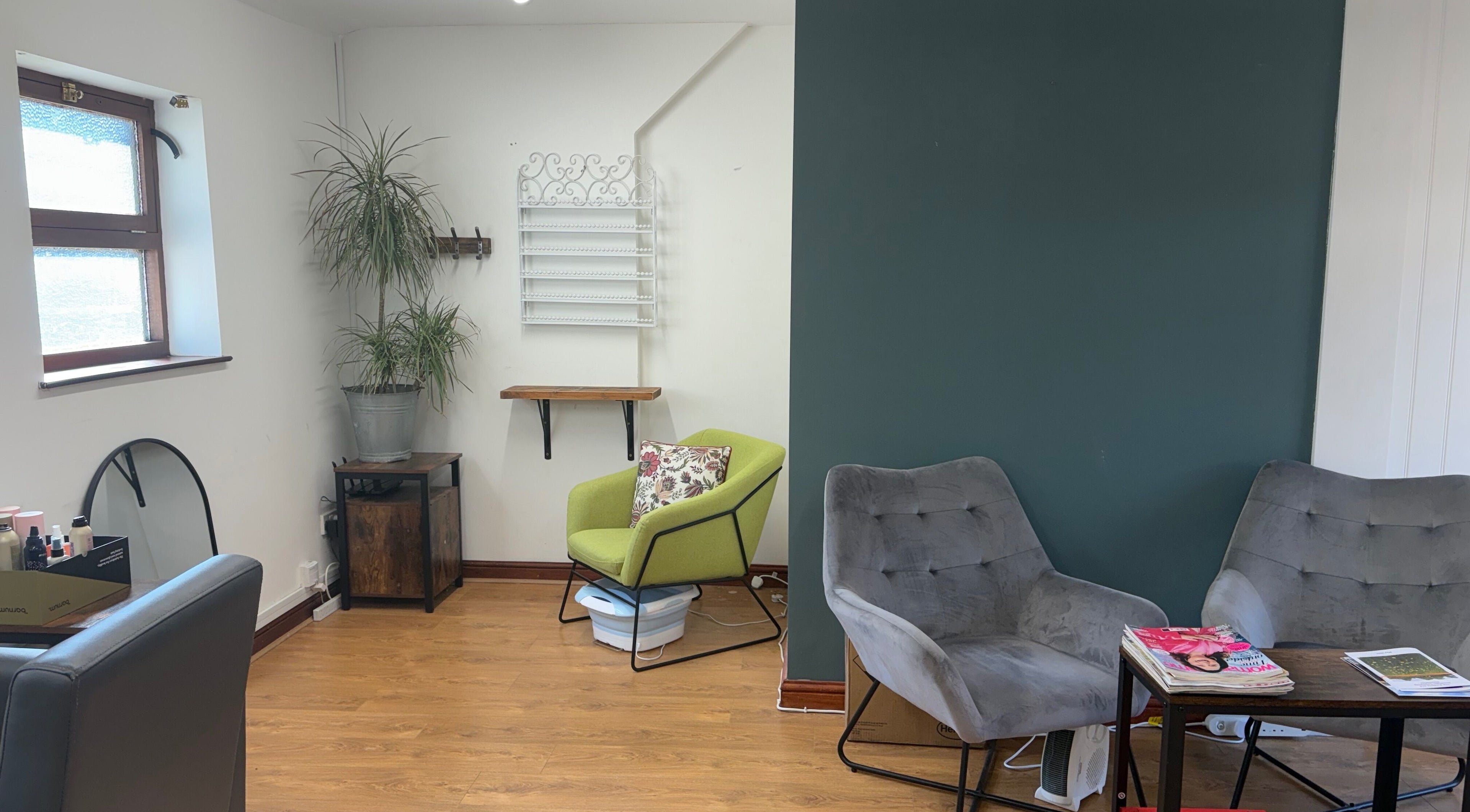 Cozy waiting area at Dovecote Hair Studio (Ice) with modern chairs, Oxford, England, GB.
