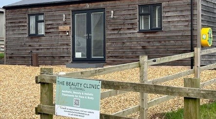 Exterior of The Beauty Clinic in Stafford, England, GB with wooden facade and sign.