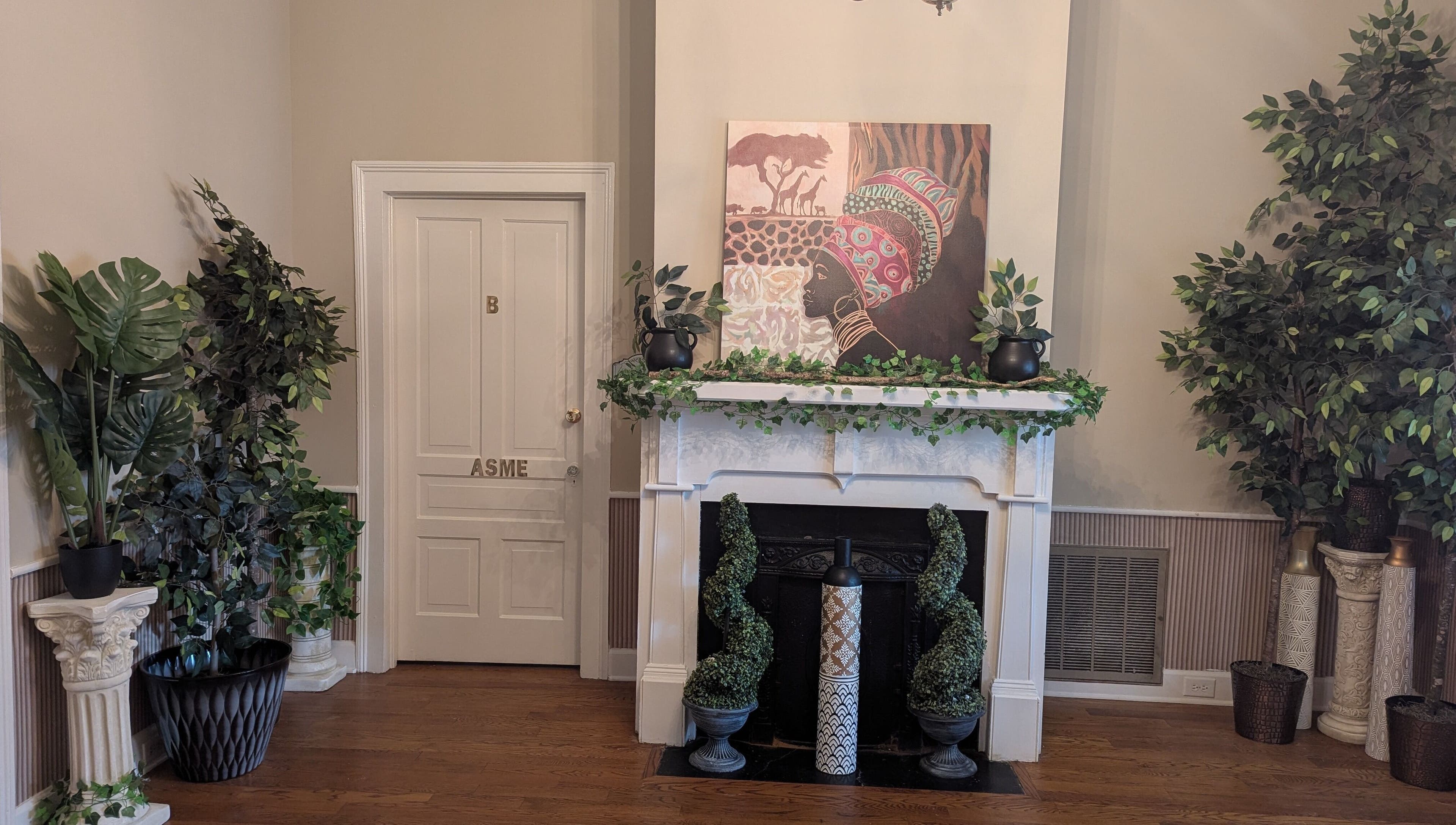 Lush interior with green plants and art at Arlana Styles Manextensions (ASME), Latta, South Carolina, US.