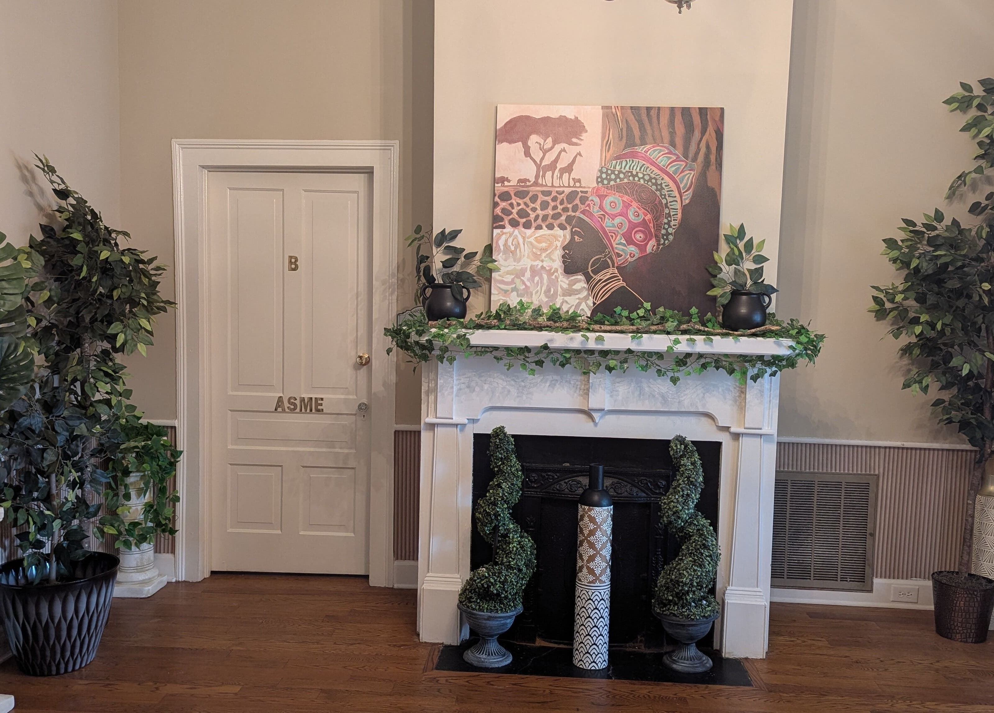 Lush interior with green plants and art at Arlana Styles Manextensions (ASME), Latta, South Carolina, US.