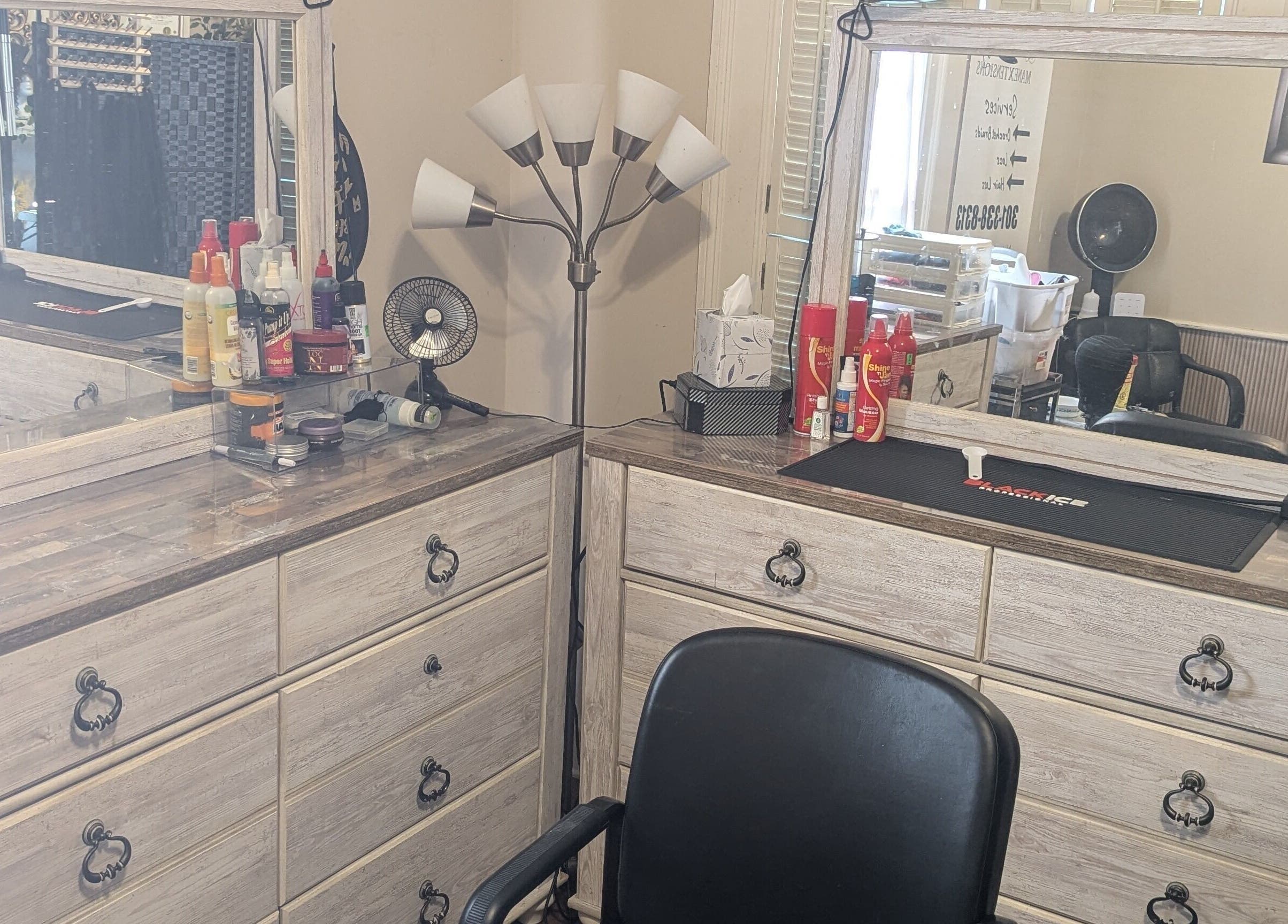 Elegant hair styling station at Arlana Styles Manextensions (ASME), Latta, South Carolina, US, with tools and products.