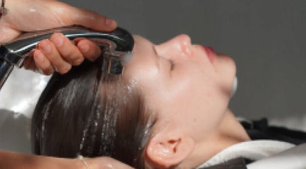 Hair care service at Hair Salon in Pererenan — Rasa Gaya, Bali, Bali, ID with woman receiving hair rinse.