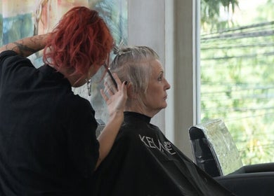 Professional stylist at Hair Salon & Face Massage in Ubud — RASA GAYA, Bali for a chic haircut session.