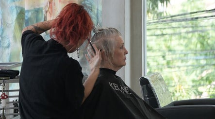 Professional stylist at Hair Salon & Face Massage in Ubud — RASA GAYA, Bali for a chic haircut session.