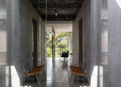 Modern interior view of Hair Salon & Facial in Ubud — RASA GAYA, featuring sleek gray walls and seating. Bali, Bali, ID.