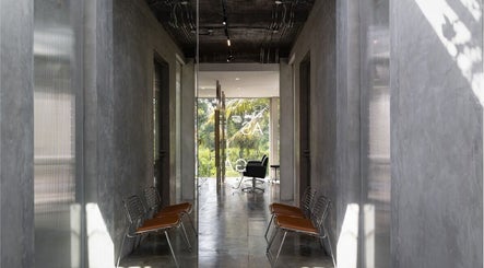 Modern interior view of Hair Salon & Facial in Ubud — RASA GAYA, featuring sleek gray walls and seating. Bali, Bali, ID.