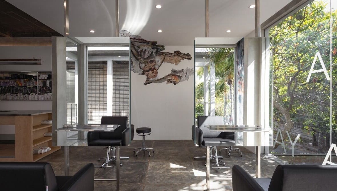 Sleek interior of Hair Salon & Facial in Ubud — RASA GAYA, Bali, Indonesia with mirrors and comfortable seating.
