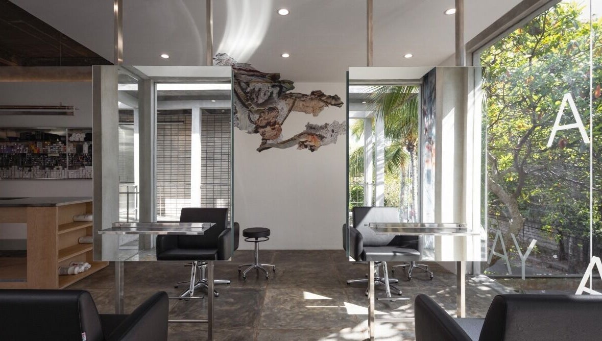 Sleek interior of Hair Salon & Facial in Ubud — RASA GAYA, Bali, Indonesia with mirrors and comfortable seating.