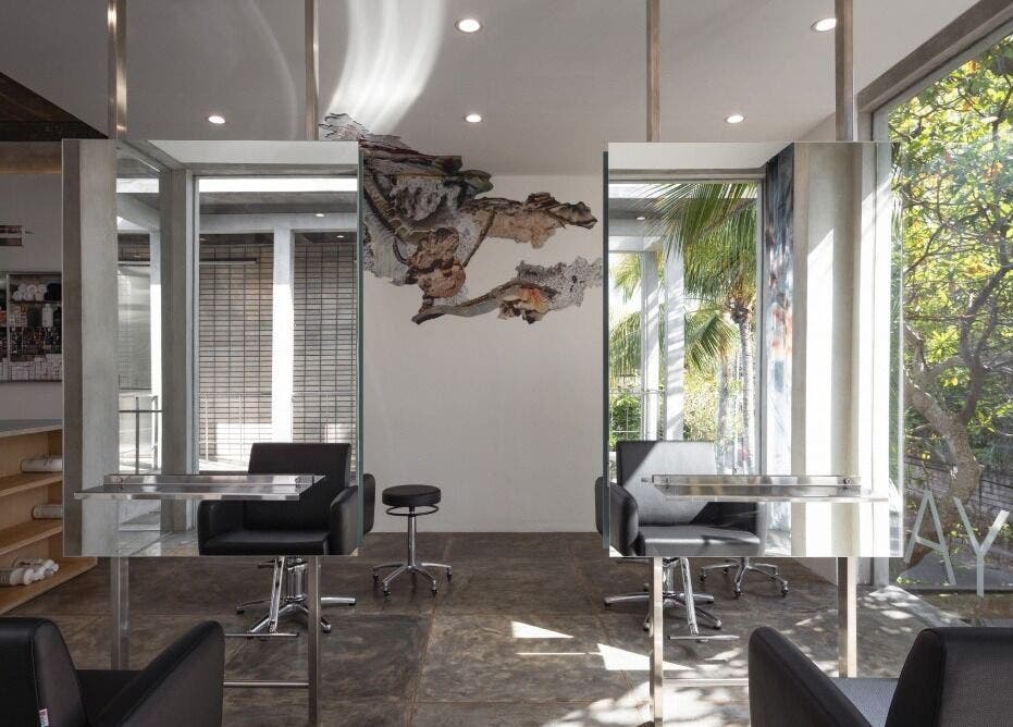 Sleek interior of Hair Salon & Facial in Ubud — RASA GAYA, Bali, Indonesia with mirrors and comfortable seating.