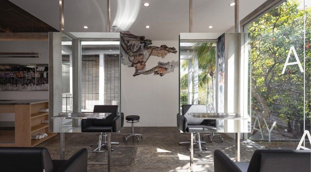 Sleek interior of Hair Salon & Facial in Ubud — RASA GAYA, Bali, Indonesia with mirrors and comfortable seating.