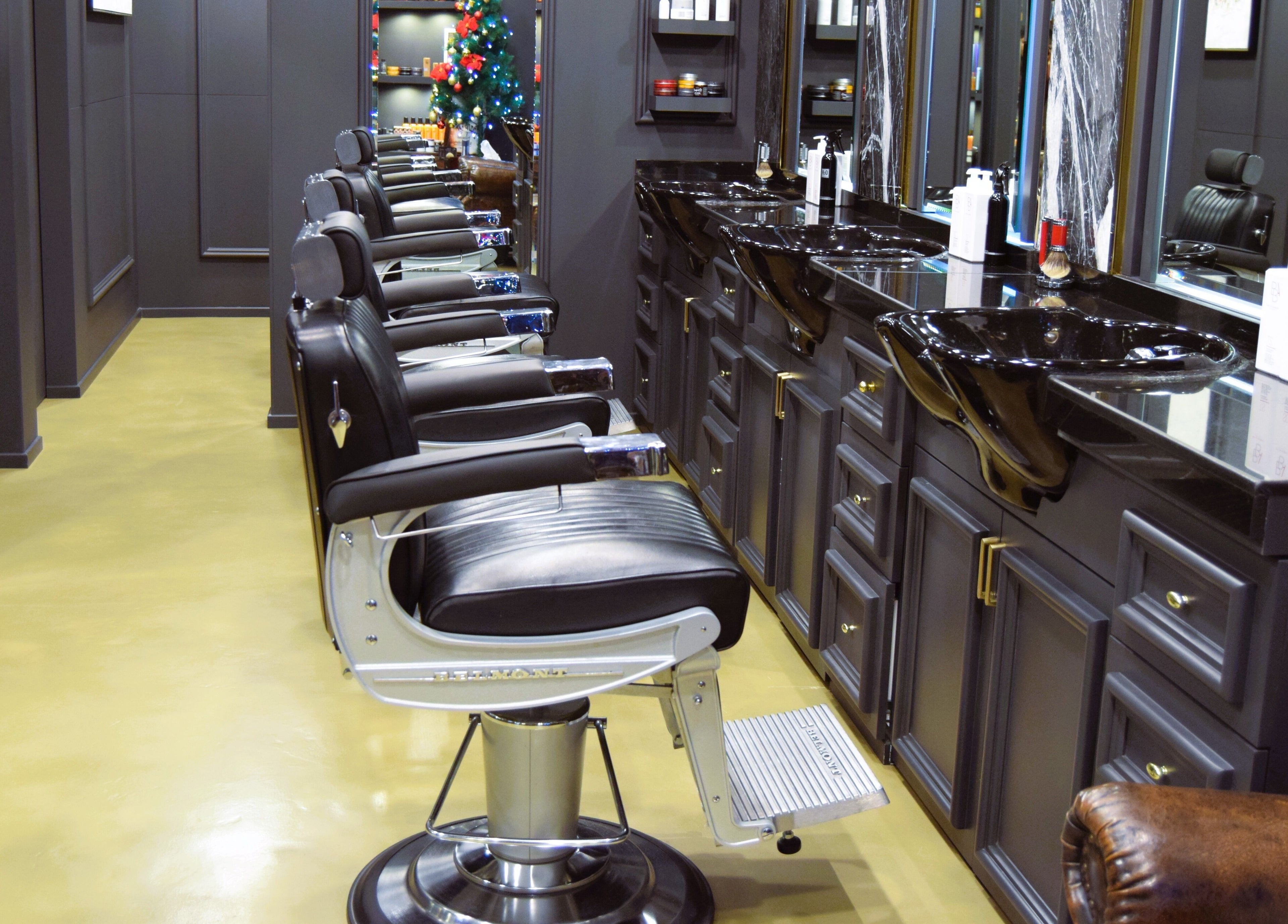 Elegant barber chairs at UB Grooming Salon Ltd. DIFC, Dubai, AE, offering a luxurious grooming experience.