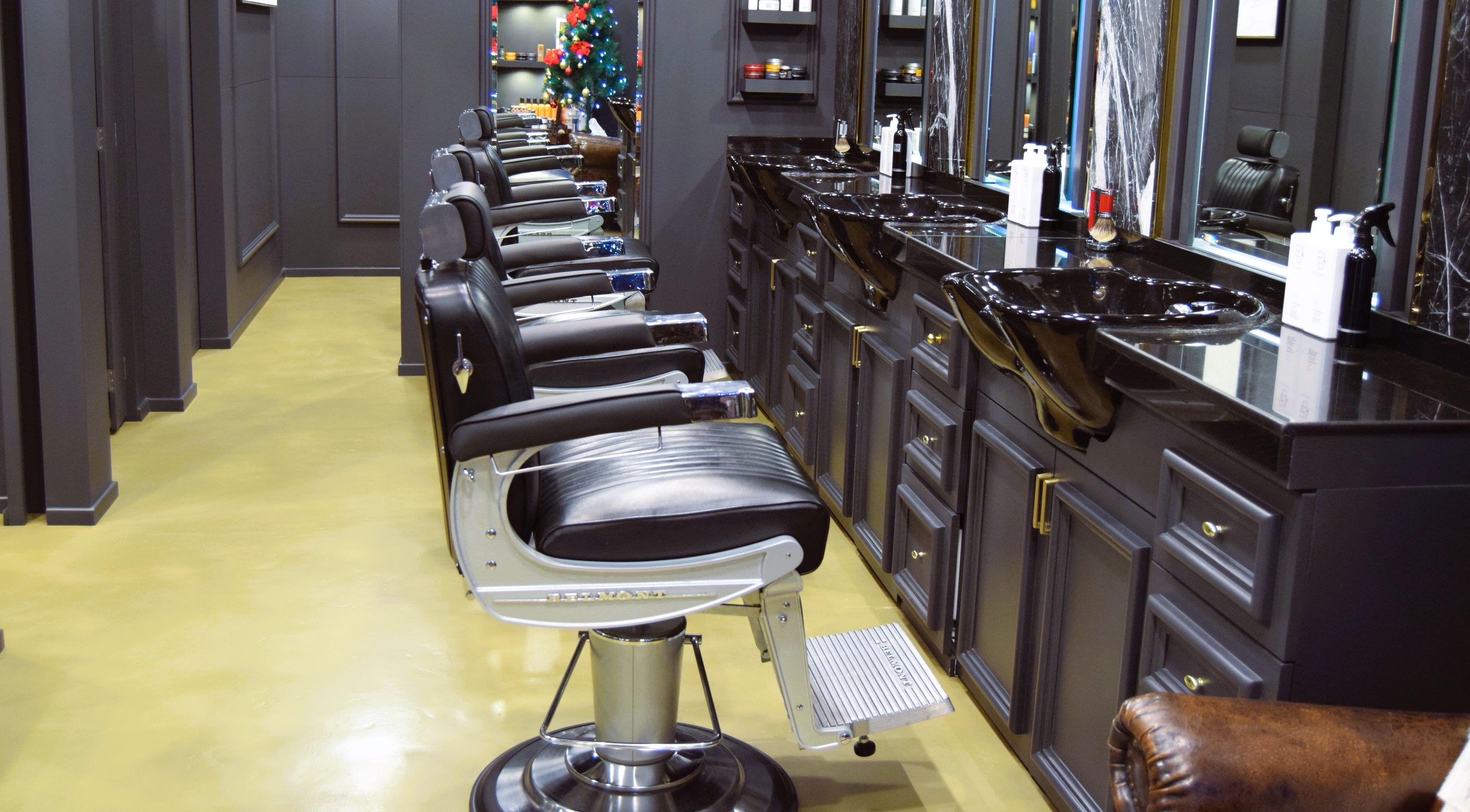 Elegant barber chairs at UB Grooming Salon Ltd. DIFC, Dubai, AE, offering a luxurious grooming experience.
