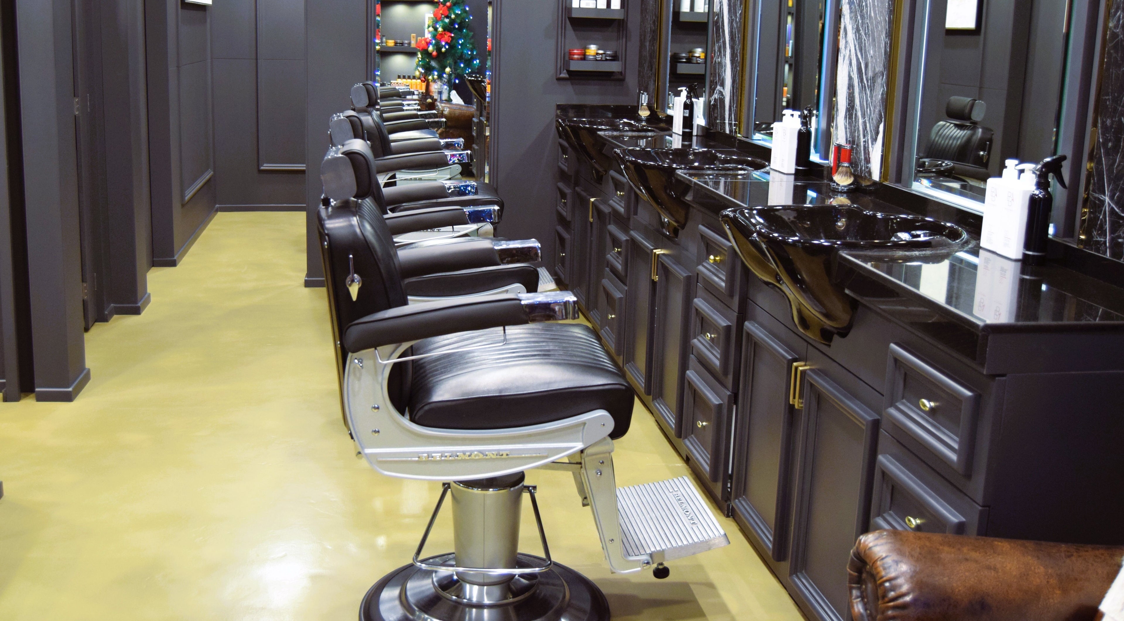 Elegant barber chairs at UB Grooming Salon Ltd. DIFC, Dubai, AE, offering a luxurious grooming experience.