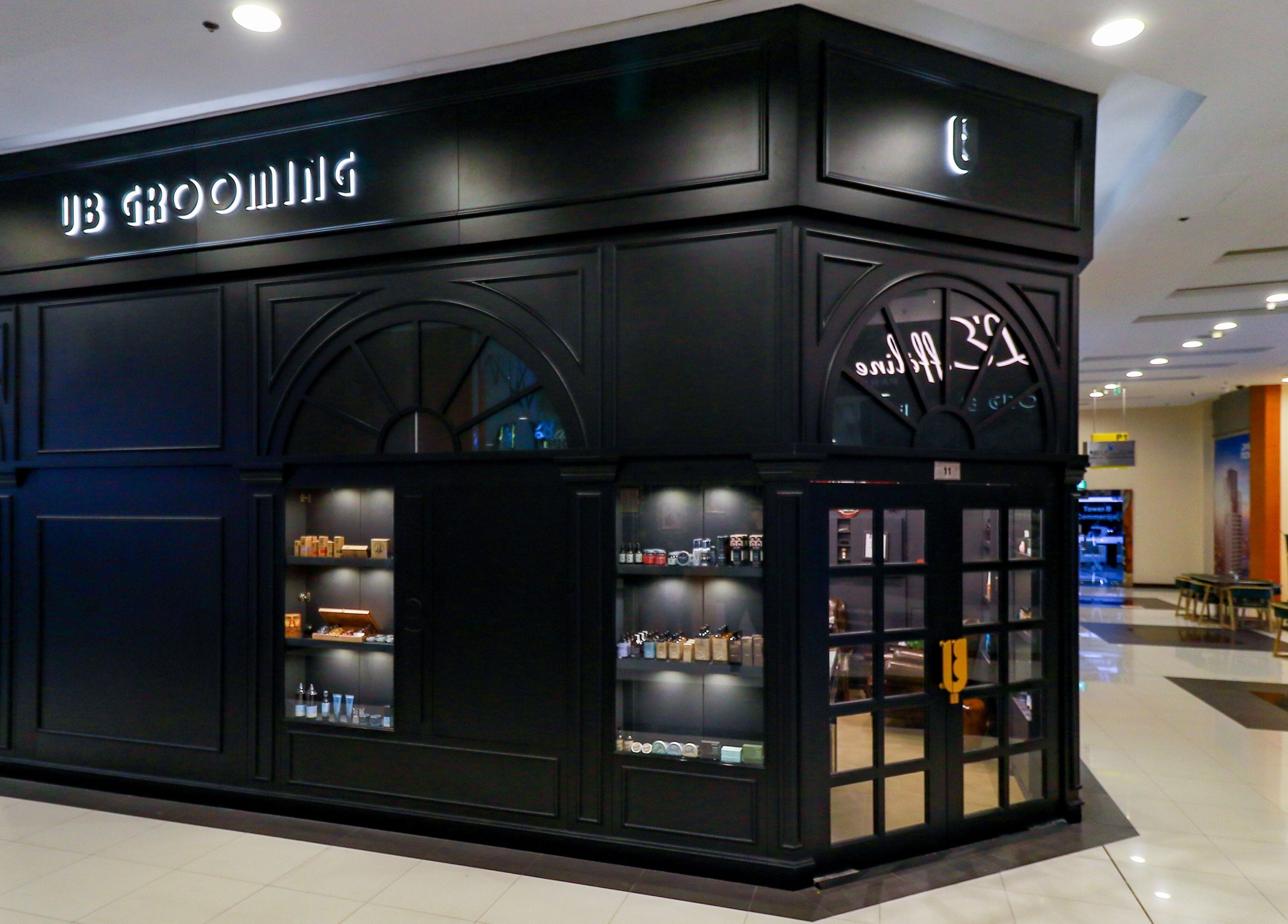 Exterior of UB Grooming Salon Ltd. DIFC in Dubai, AE showcasing sleek design and product displays.