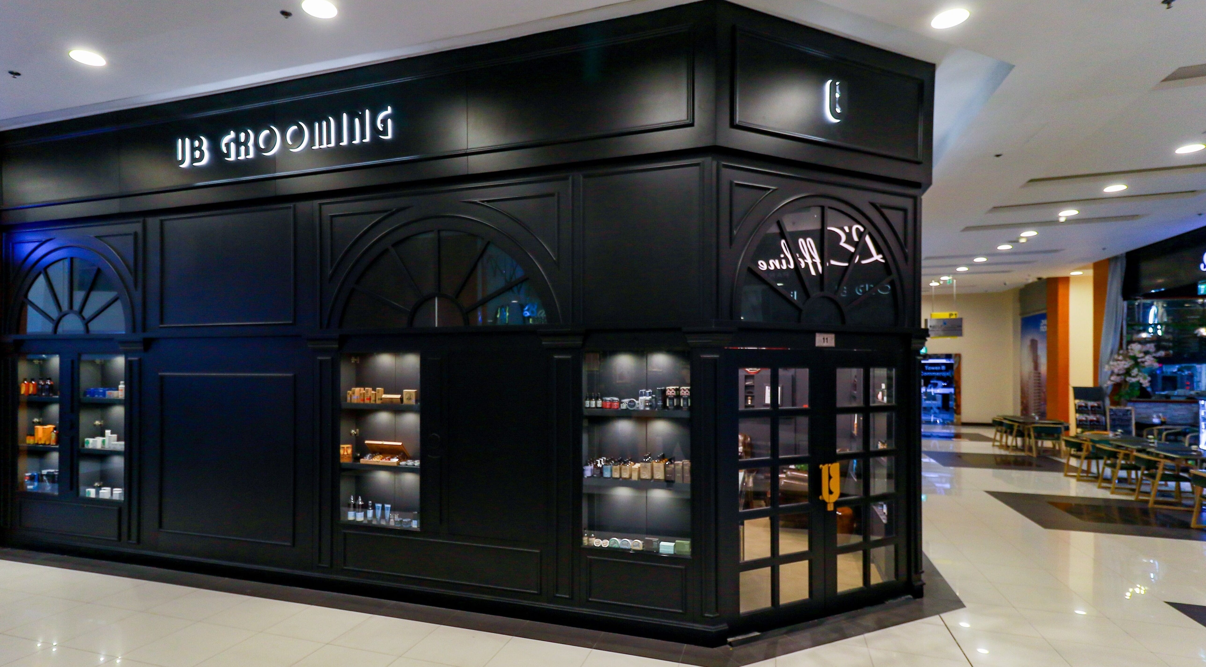 Exterior of UB Grooming Salon Ltd. DIFC in Dubai, AE showcasing sleek design and product displays.