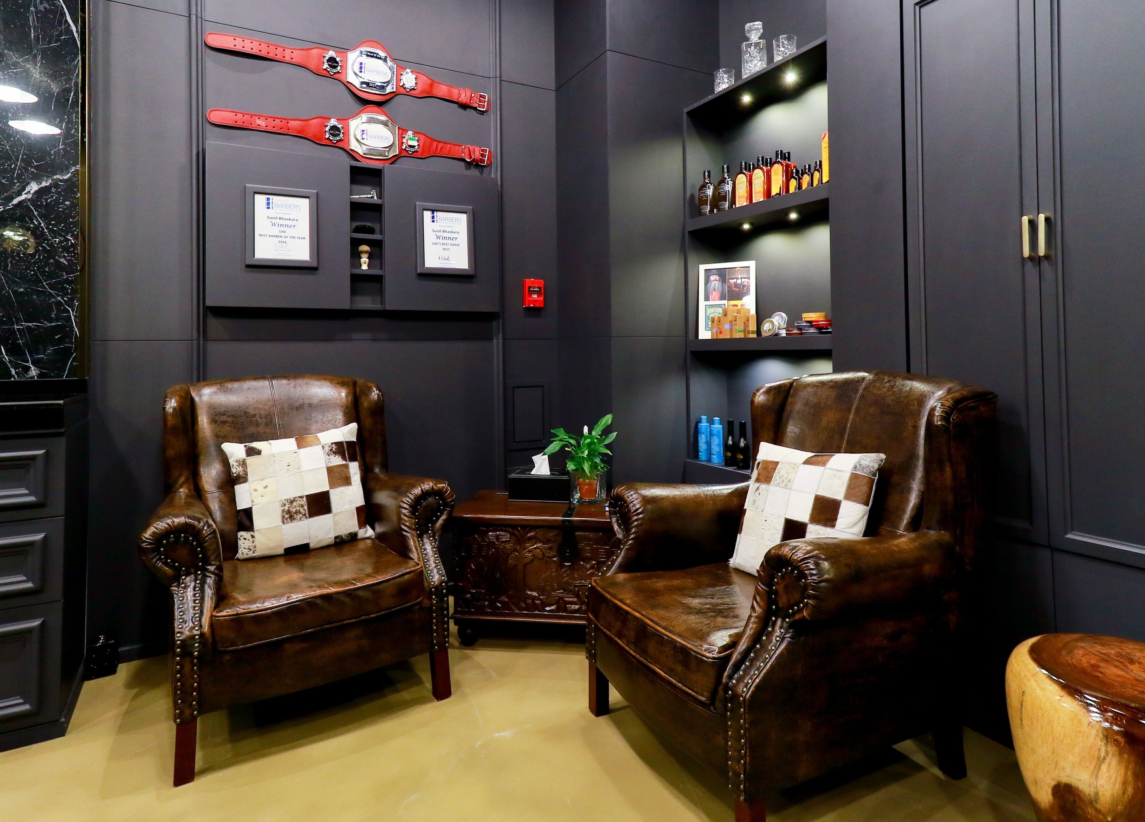 Elegant leather seating at UB Grooming Salon Ltd. DIFC, Dubai, AE, offering a luxurious atmosphere for relaxation.