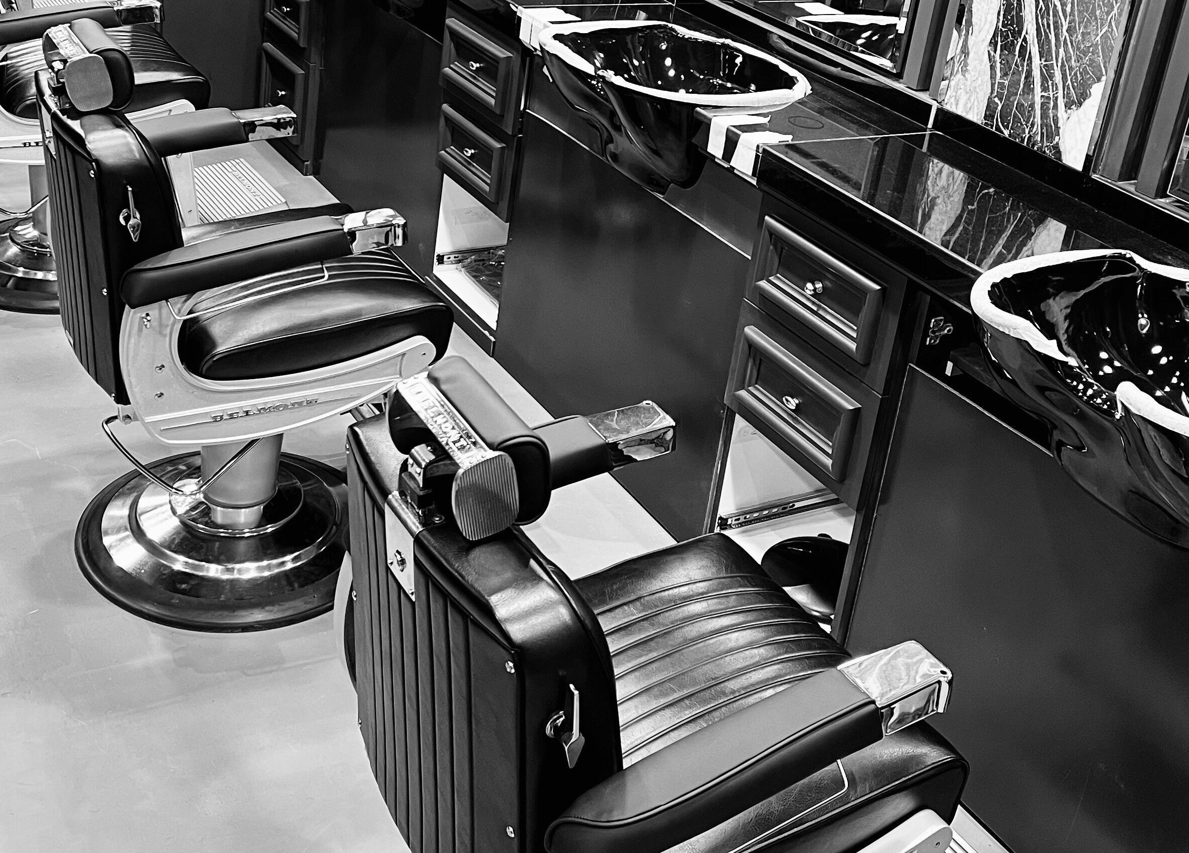 Luxurious barber chairs at UB Grooming Salon Ltd. DIFC, Dubai, AE offering upscale grooming services.