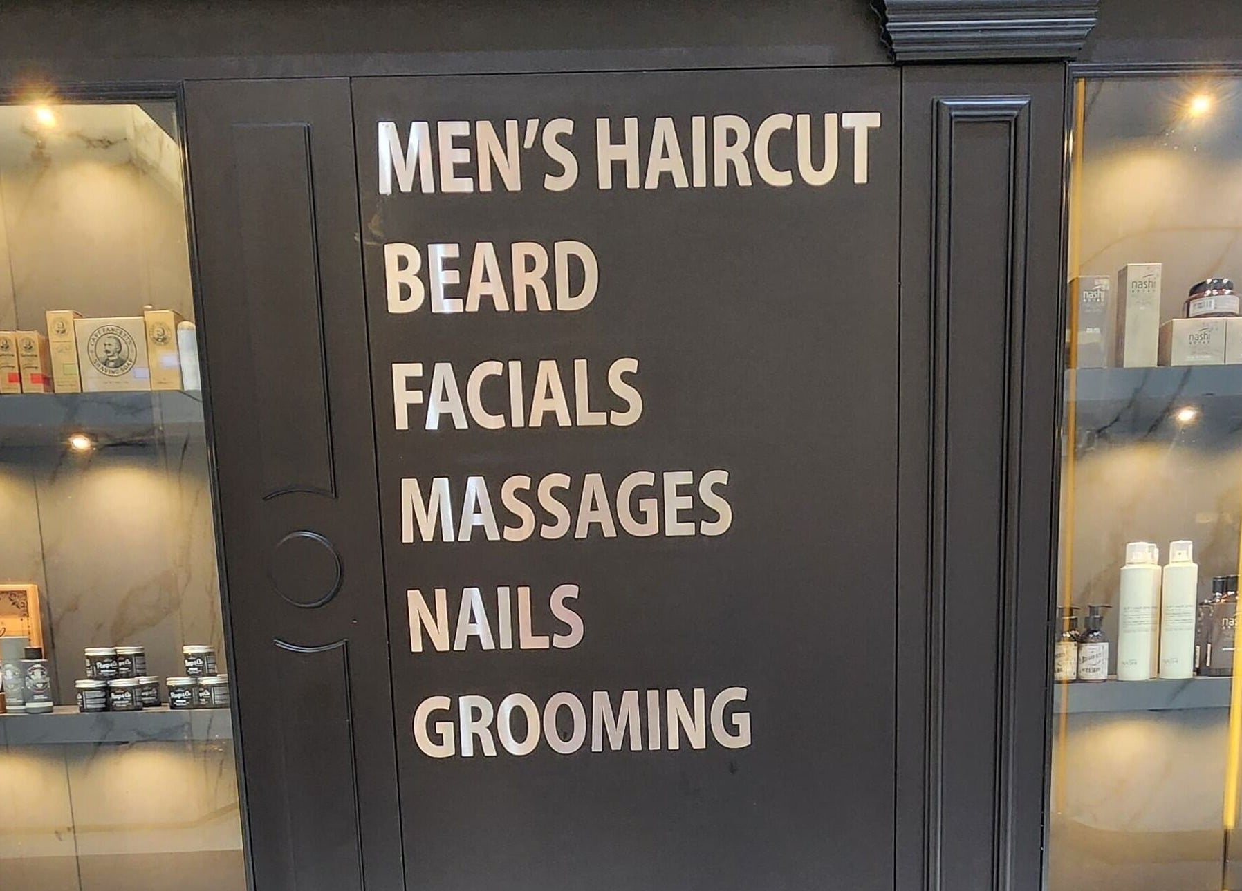 Service offerings at UB Grooming Salon Ltd. DIFC, Dubai, AE showing haircuts, beard care, facials, massages, nails.