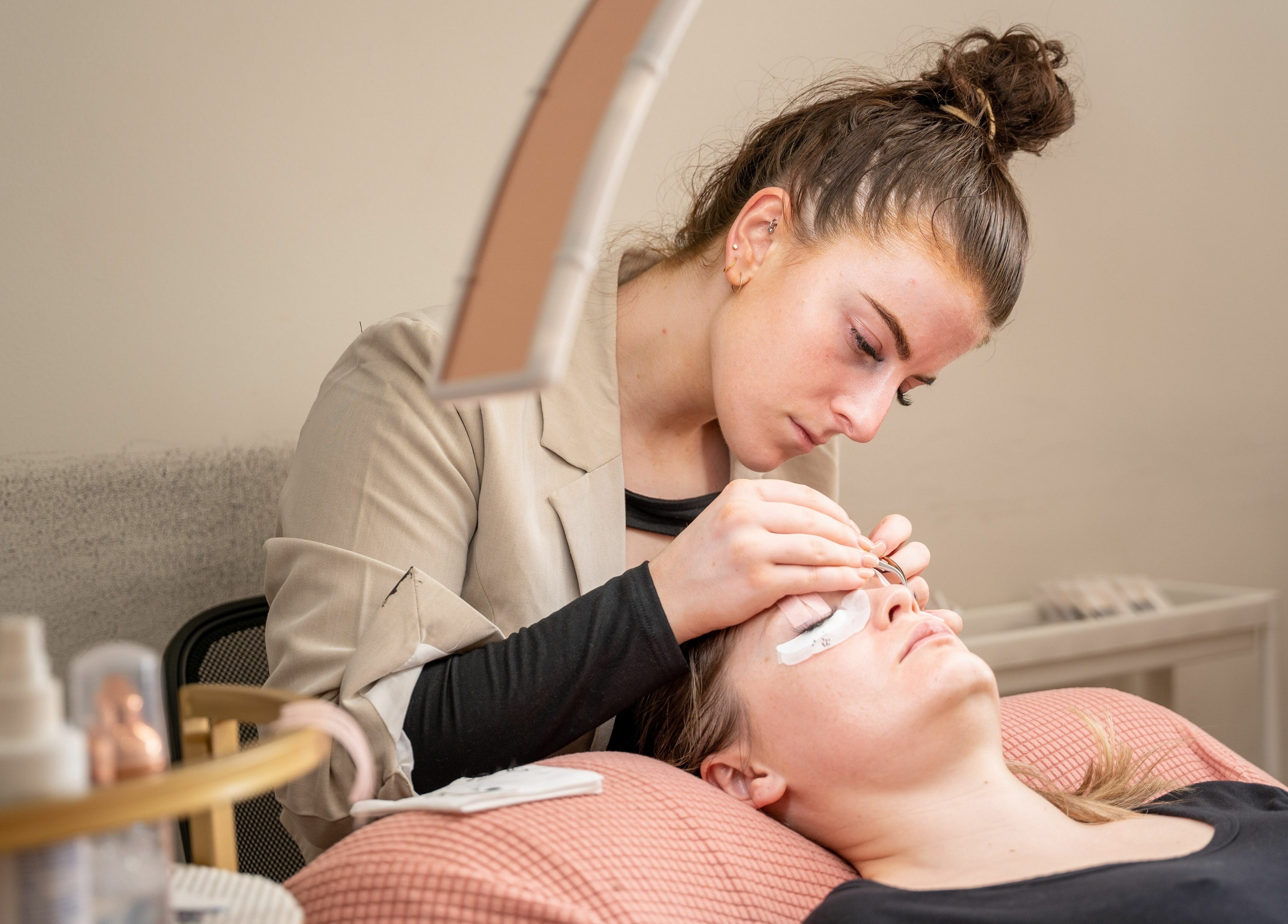 Expert adds eyelash extensions at The Seven Great Lashes, Melbourne, Victoria, AU for a luxurious beauty experience.