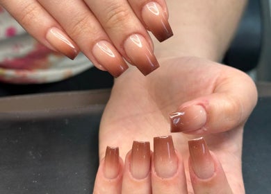 Elegant ombre nails at Nail Couture Cave Creek, Cave Creek, Arizona, US offer a chic manicure style.