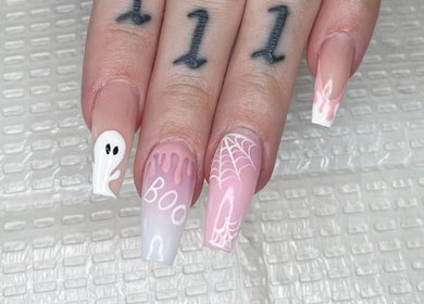 Creative spooky nail art design at Nail Couture Cave Creek, Cave Creek, Arizona, US, featuring ghost and web motifs.