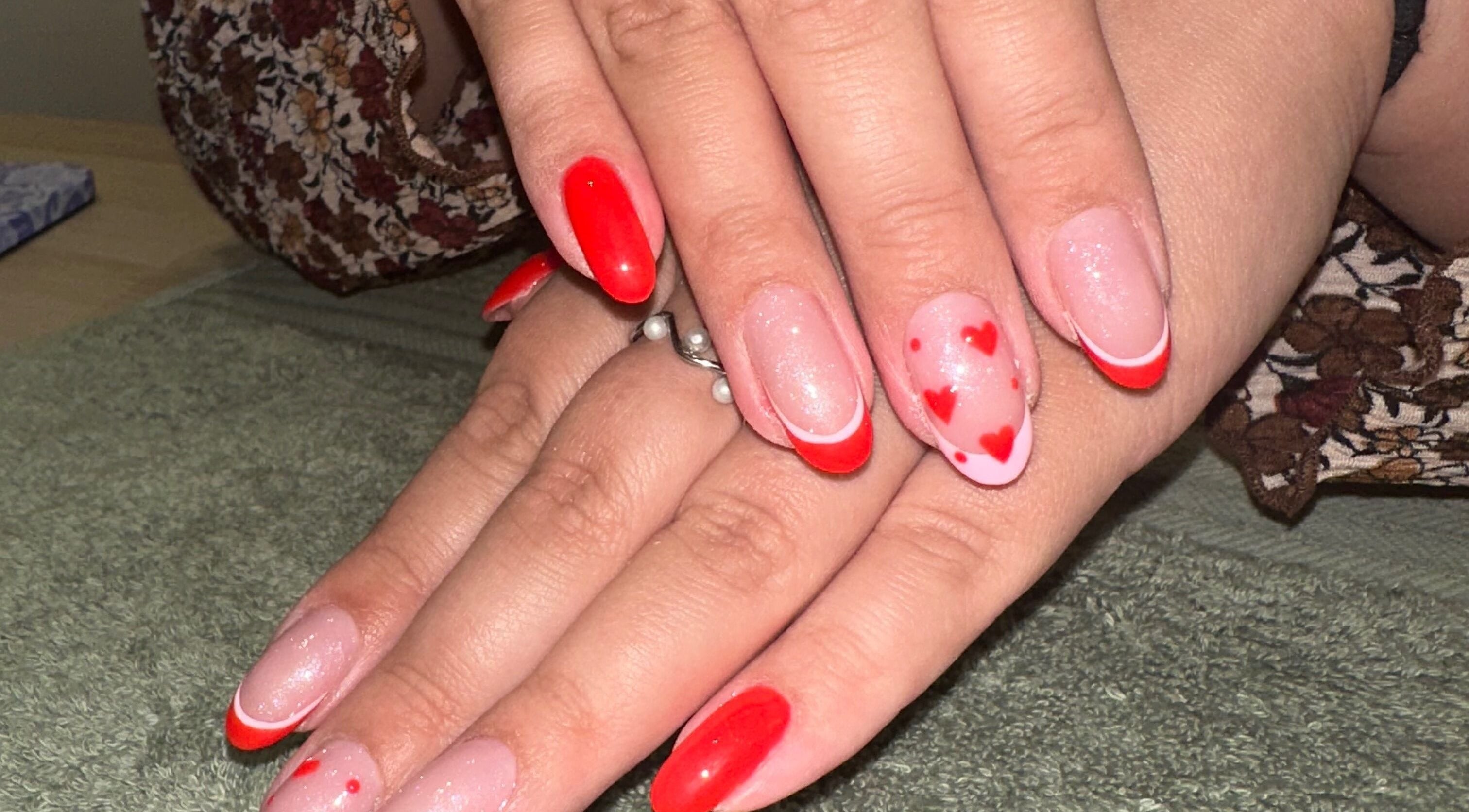 Stylish red and pink nail art design at Holly Jade Beauty, Workington, England, GB.