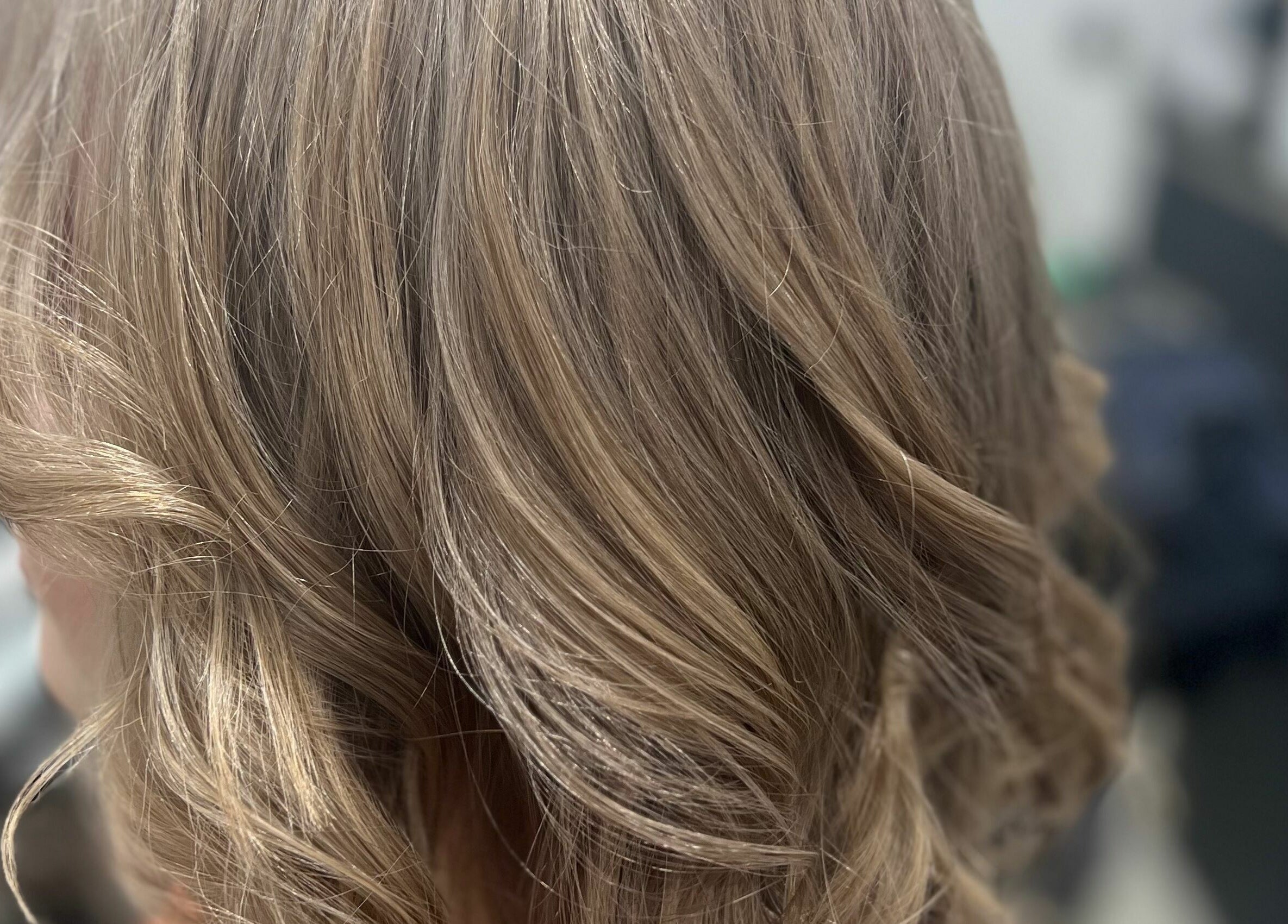 Chic wavy hairstyle at Mane On Mowbray, East Brisbane, Queensland, AU salon highlighting glossy texture.