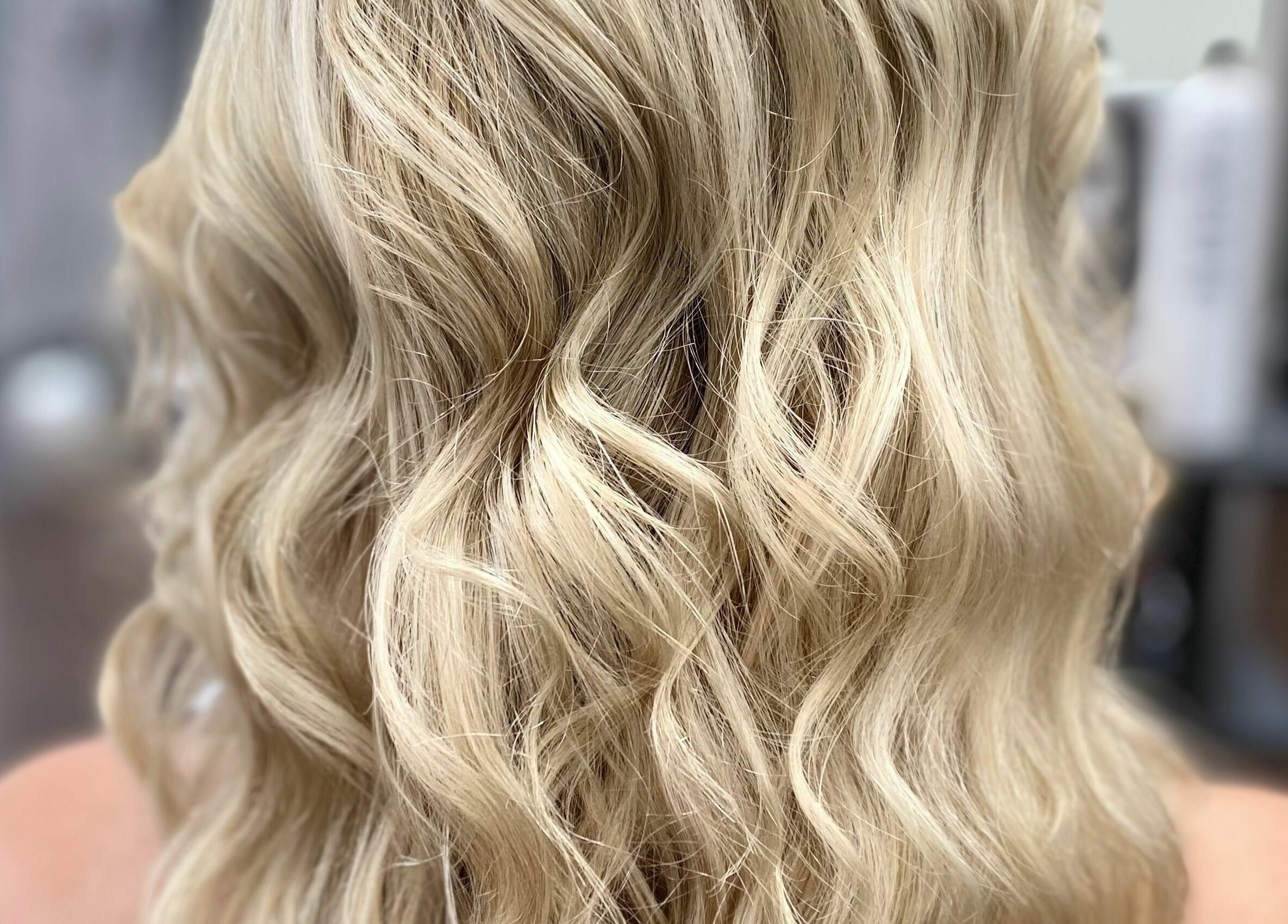 Blonde wavy hairstyle at Mane On Mowbray in East Brisbane, Queensland, AU, showcasing salon expertise.