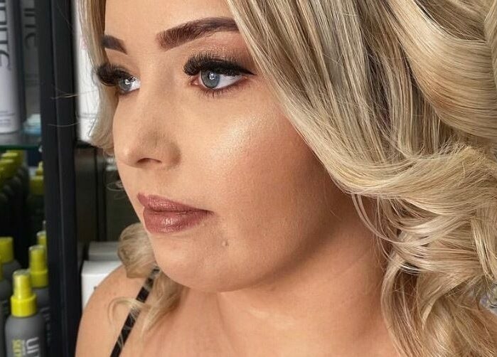 Blonde woman's styled hair at Mane On Mowbray, East Brisbane, Queensland, AU.