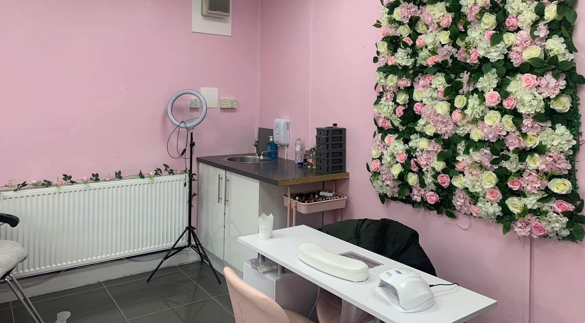 Chic nail station with floral wall at Brogan Nails and Beauty, Edinburgh, Scotland, GB.