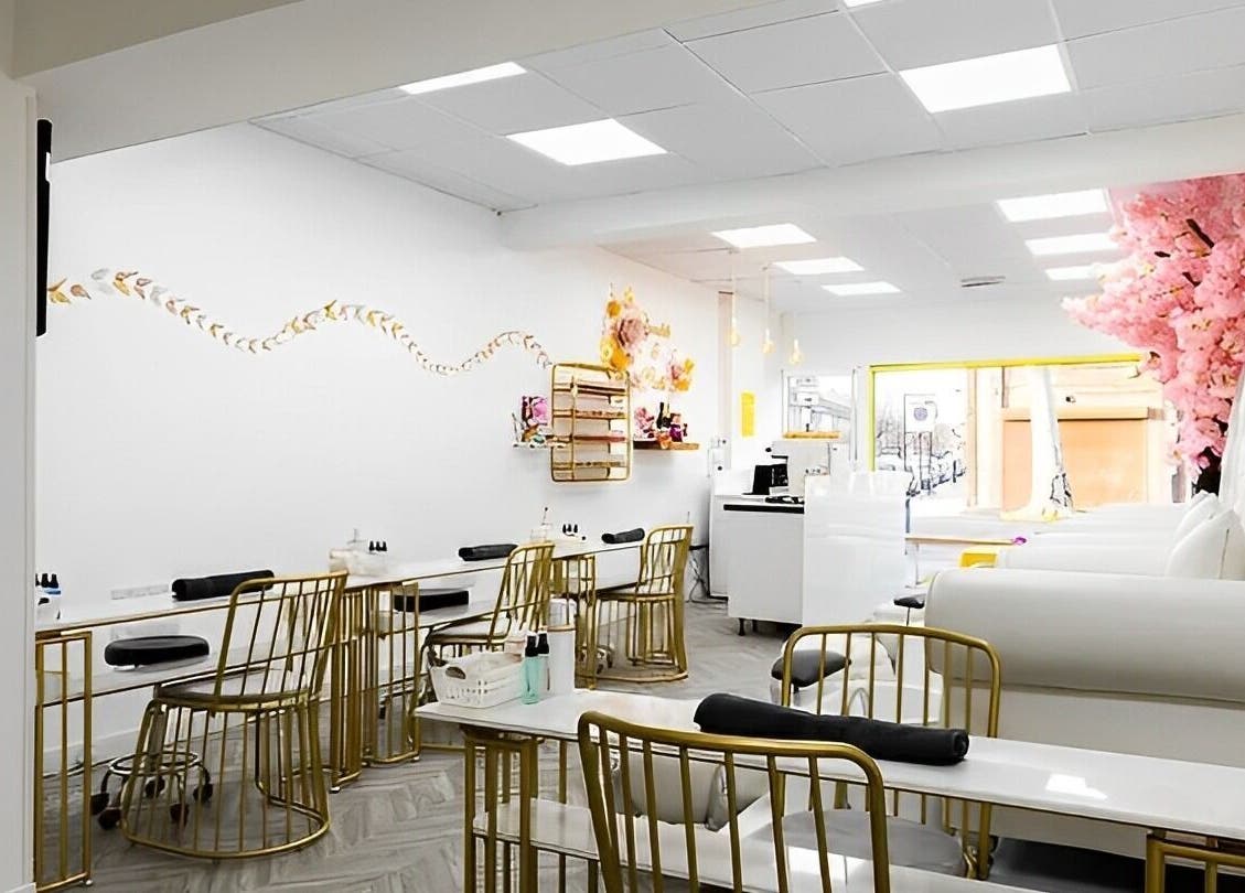 Spacious, elegant interior of Chocolate & Nails - Northfield, London, England, GB featuring stylish seating and decor.