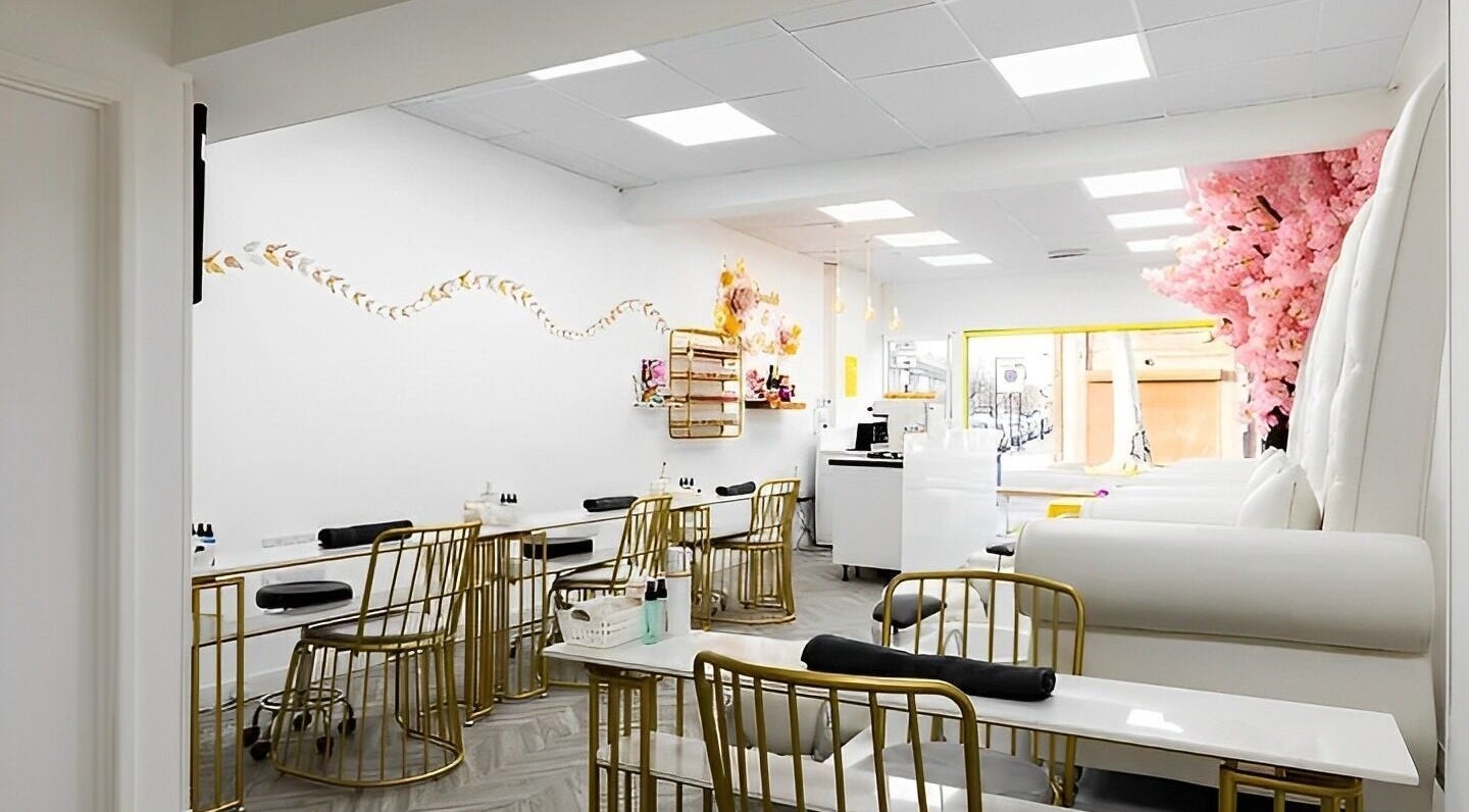 Spacious, elegant interior of Chocolate & Nails - Northfield, London, England, GB featuring stylish seating and decor.