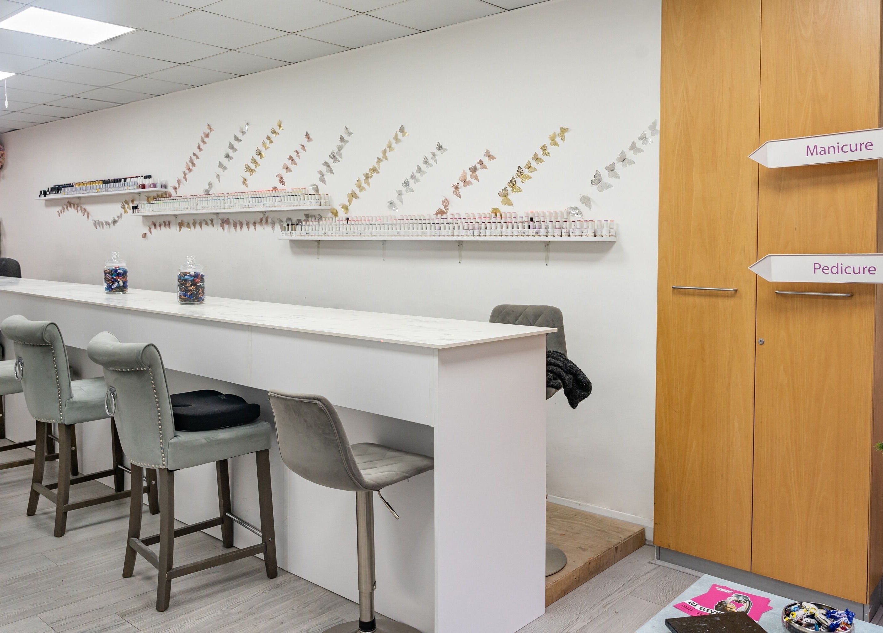 Interior of Chocolate & Nails - Ealing Broadway showing manicure and pedicure stations in London, England, GB.