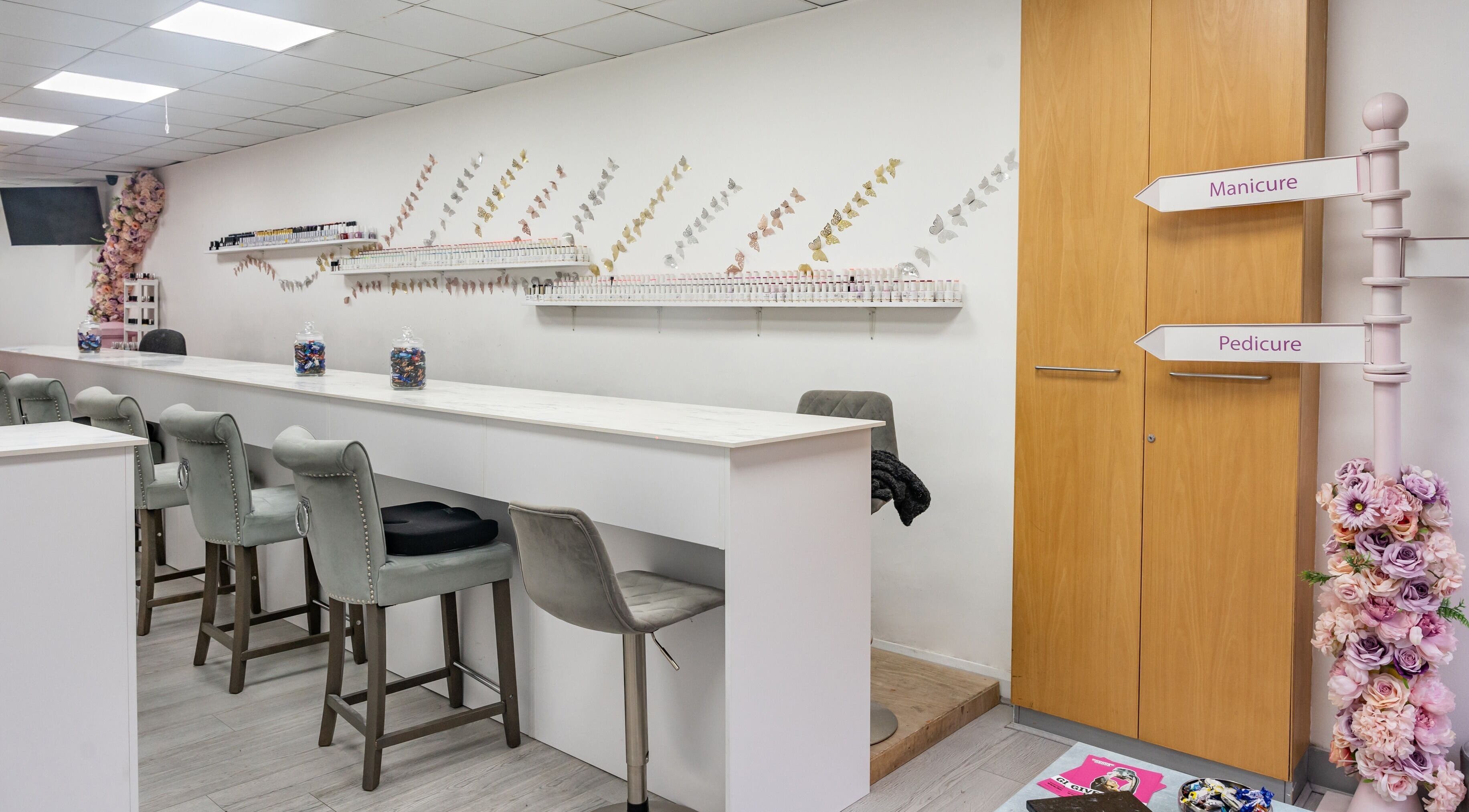 Interior of Chocolate & Nails - Ealing Broadway showing manicure and pedicure stations in London, England, GB.
