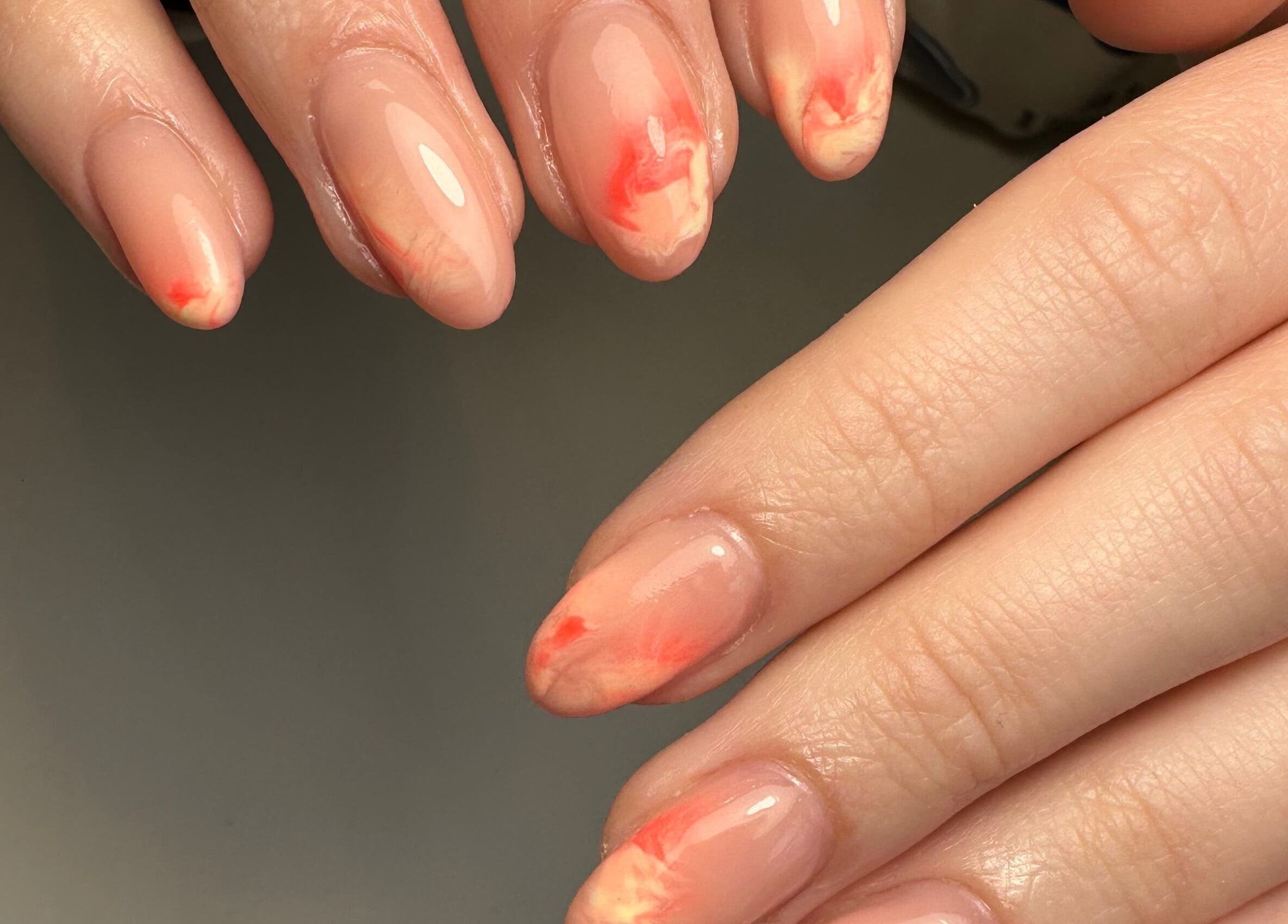 Elegant coral nail art at Pink Studios, Middlesbrough, England, GB, showcasing intricate design.