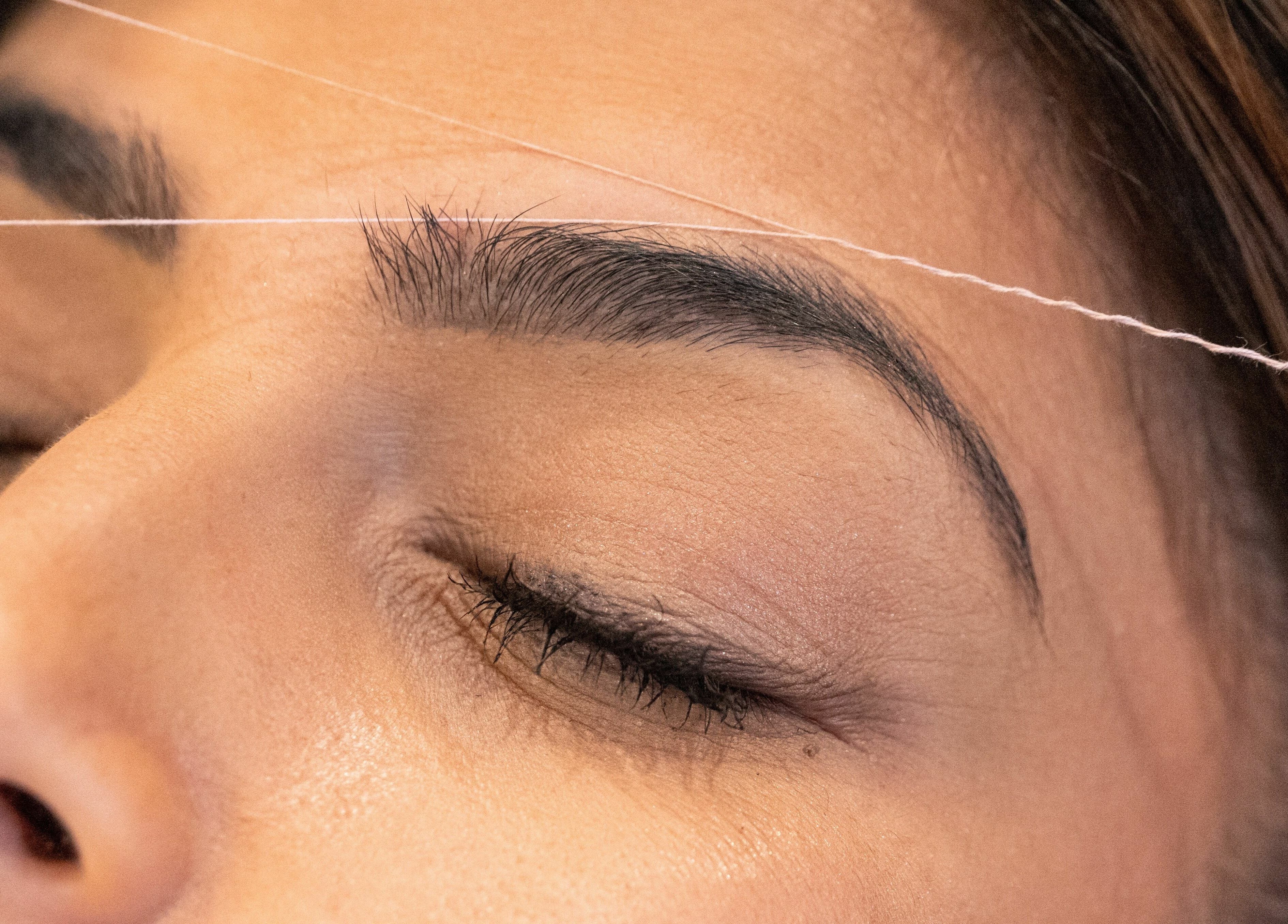 Eyebrow threading at Elysian Beauty Bar Inc, Windsor, Ontario, CA. Expert care for perfectly shaped brows.